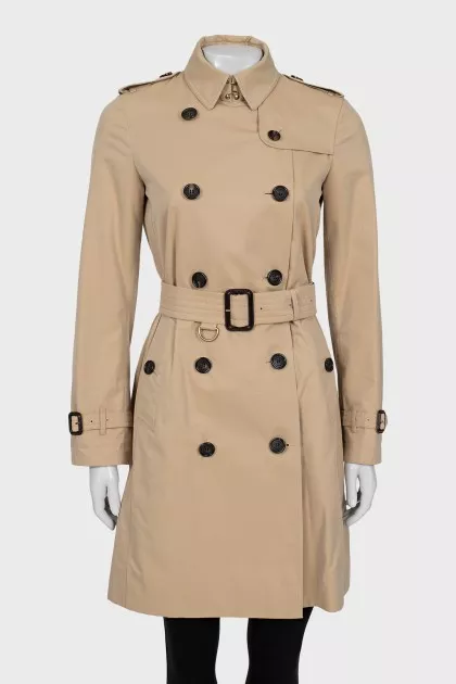 Beige trench coat with branded buttons