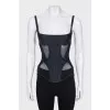 Corset with zipper and transparent inserts