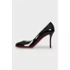 Black patent leather pumps
