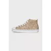 Shiny gold colored sneakers
