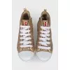Shiny gold colored sneakers