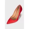 Red satin pumps