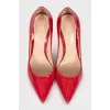 Red patent leather pumps