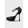 Black patent leather shoes with a figured heel