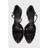 Black patent leather shoes with a figured heel