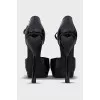 Black patent leather shoes with a figured heel