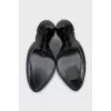 Black patent leather shoes with a figured heel