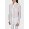 Blouse shirt with a fastener
