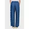 Wide trousers in white polka dots