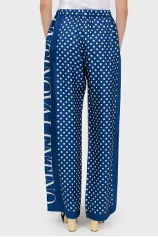 Wide trousers in white polka dots