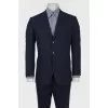 Male suit dark blue in blue-red and gray stripes