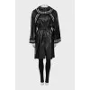Leather coat with knitted elements