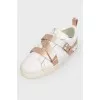 White sneakers with belt buckle
