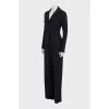 A suit of loose trousers and a fitted blazer