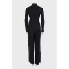 A suit of loose trousers and a fitted blazer