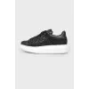 Black sneakers with white thick sole