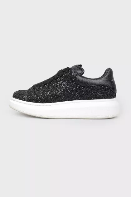 Black sneakers with white thick sole