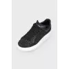 Black sneakers with white thick sole