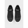 Black sneakers with white thick sole