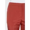 Red trousers with embroidery