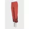 Red trousers with embroidery
