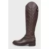 Boots with embossing in the form of a logo