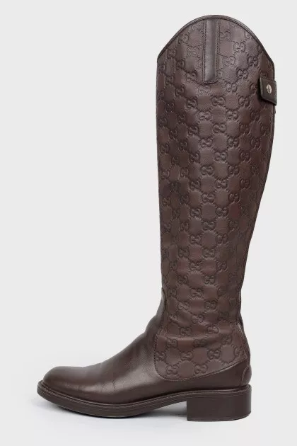 Boots with embossing in the form of a logo