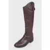 Boots with embossing in the form of a logo