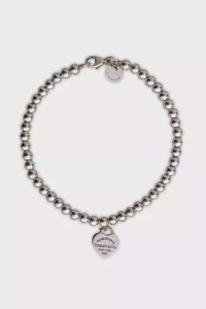 Silver bracelet with heart pendant
