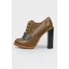 Brown boots with dark blue patch