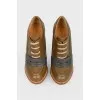Brown boots with dark blue patch