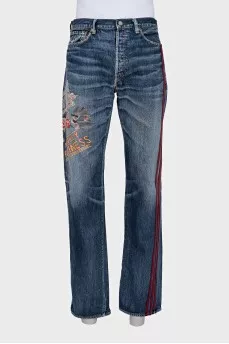 Men's jeans with red stripes on the side