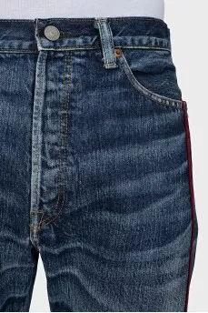 Men's jeans with red stripes on the side