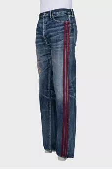 Men's jeans with red stripes on the side