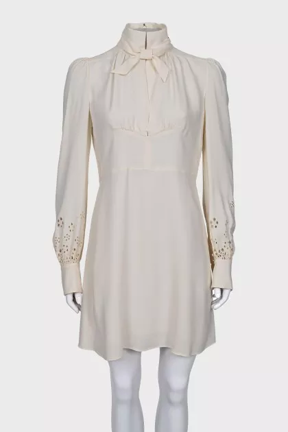Dress with perforated sleeves