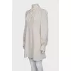 Dress with perforated sleeves
