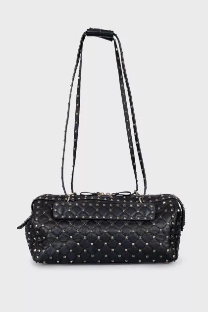 Leather bag decorated with spikes