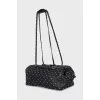 Leather bag decorated with spikes