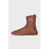 Brown boots with gold logo