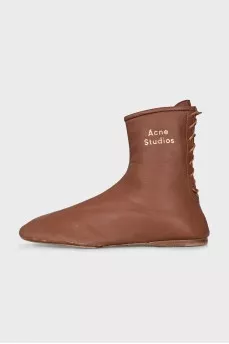 Brown boots with gold logo