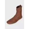 Brown boots with gold logo