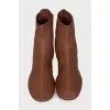 Brown boots with gold logo