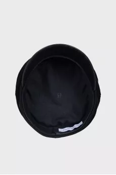 Wool cap with patent leather visor