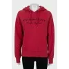 Red hoodie with branded embroidery