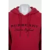 Red hoodie with branded embroidery