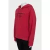 Red hoodie with branded embroidery