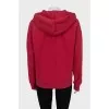 Red hoodie with branded embroidery