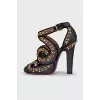 Braided sandals with gold decor