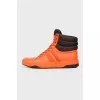 Orange leather sneakers are high