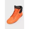 Orange leather sneakers are high
